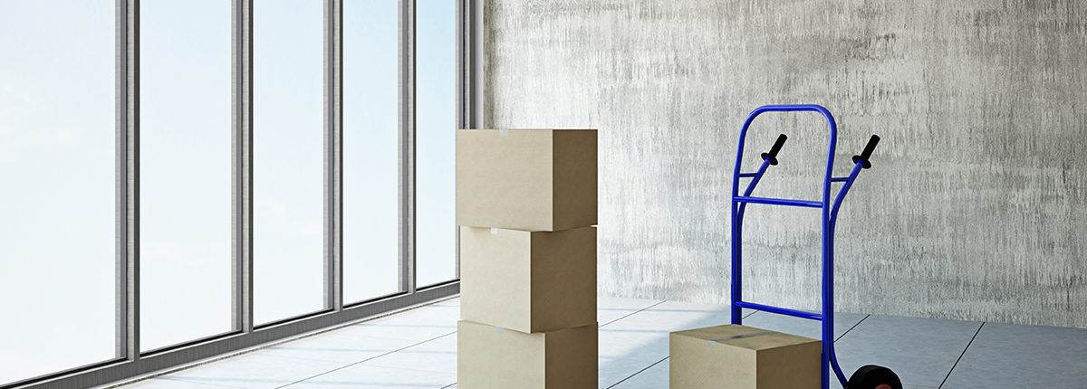 17858766 - empty room with boxes and pushcart near the window